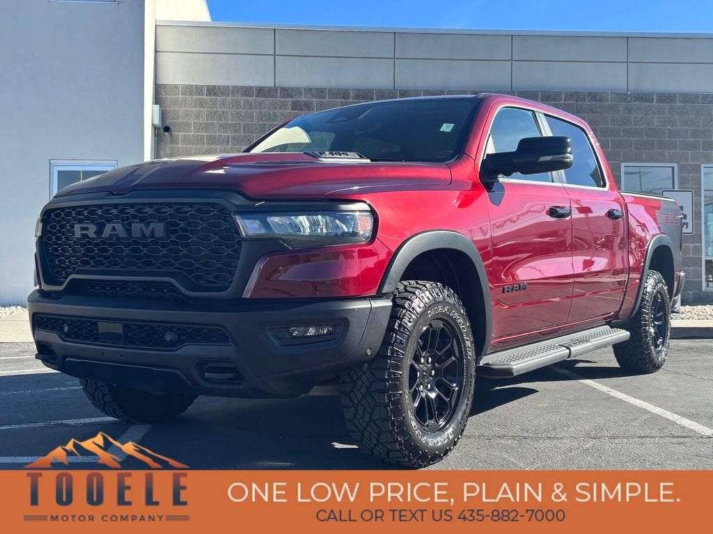 2025 RAM 1500 Rebel Crew Cab 4x4 5'7" Box in Red — front three-quarter view